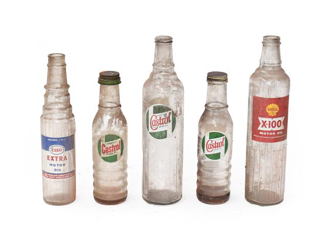 Lot 32 - ~ Five Vintage Glass Oil Bottles, comprising a large Castrol Motor Oil, a Shell X-100, a...