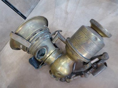 Lot 72 - Four Early 20th Century Brass Bicycle Lamps, comprising one stamped Badger Brass MFG Company...
