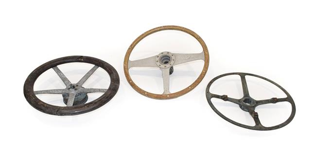 Lot 73 - Three Vintage Steering Wheels, comprising a three-spoke example with moulded wheel, a...