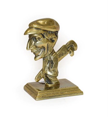 Lot 116 - A Solid Brass Mascot, as a golfer carrying golf clubs, stamped Dunlop, the reverse stamped Reg...