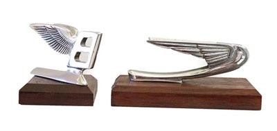 Lot 138 - A 1950's Bentley Winged B Car Mascot, of stylised form, mounted on a wooden base, 8cm high; and...