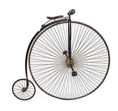 Lot 244 - ~ A Late 19th Century Penny Farthing Bicycle, with brown padded seat, turned wooden handle grips, a