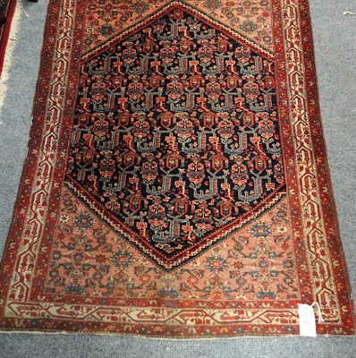 Lot 1468 - Feraghan Rug  West Persia The deep indigo stepped lozenge field with a lattice of stylised...