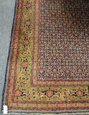 Lot 1472 - Tabriz Carpet  Persian Azerbaijan The deep indigo field with an allover Herati design enclosed...