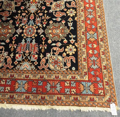 Lot 1475 - Caucasian Design Carpet  Probably Turkey The deep indigo field with an all over design of...