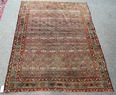 Lot 1478 - Ravar Kirman Rug  South East Persia The field with an intricate floral lattice design enclosed...