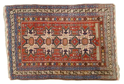 Lot 1483 - Fine Lesghi Rug South Caucasus The blood red field with three typical star medallions framed by...