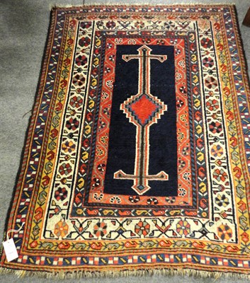 Lot 1484 - Unusual Kazak Rug  Central Caucasus  The plain indigo field centred by a stepped polychrome...