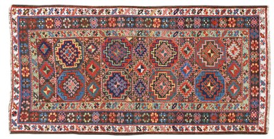 Lot 1486 - Karabagh Rug  South Caucasus The compartmentalised field with bands of polychrome hooked medallions