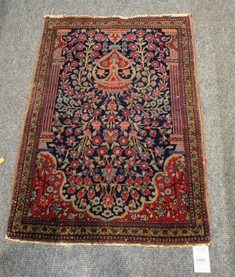 Lot 1494 - Finely Woven Kashan Mat  Central Persia The mid indigo field with an urn issuing flowers flanked by