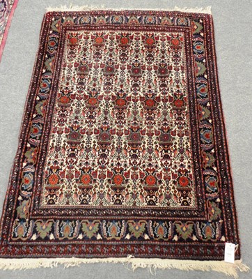 Lot 1498 - Zil-i-Sultan Rug South East Persia  The ivory field with rows of urns and flowers enclosed by...