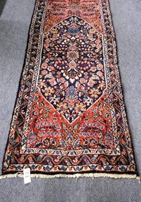 Lot 1504 - Narrow Hamadan Runner  Persian Kurdistan The rust field with central medallion flanked by two...