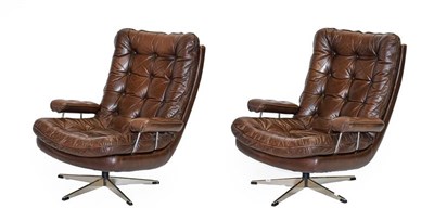 Lot 1196 - A Pair of 1970's Scandinavian Buttoned Brown Leather and Chrome Lounge Chairs, five prong base,...