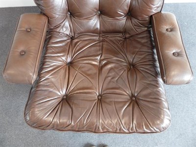 Lot 1196 - A Pair of 1970's Scandinavian Buttoned Brown Leather and Chrome Lounge Chairs, five prong base,...