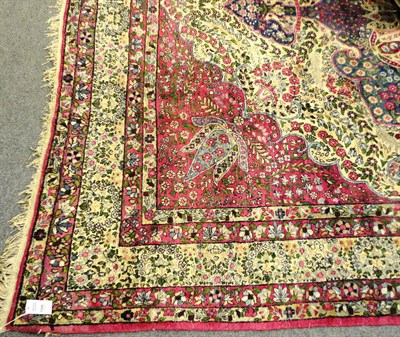 Lot 1506 - Yazd Carpet  South East Persia The cusped pale lemon field of flowing vines around a soft...