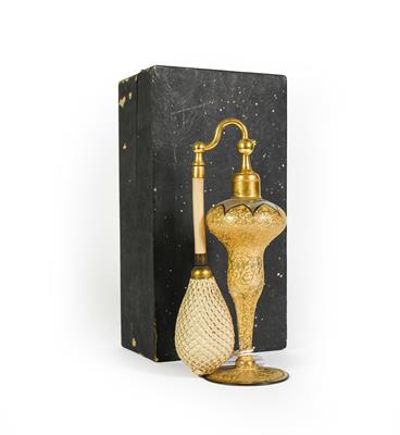 Lot 5 - A Gilt-Metal Mounted Gilt Glass Atomiser bottle, baluster and on spreading foot, in cardboard...