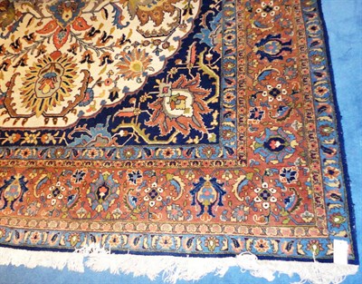 Lot 1507 - Tabriz Carpet Persian Azerbaijan The cream field of large palmettes and scrolling vines around...