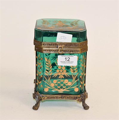Lot 12 - A Gilt-Metal Mounted Green Glass Casket, of octagonal section and on four paw feet, the glass...