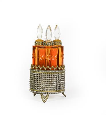 Lot 17 - A set of Four Amber Glass Scent-Bottles, each fitting into the circular paste set stand, total...