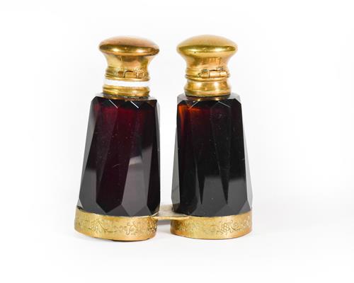 Lot 20 - A Gilt-Metal Mounted Amethyst Glass Double-Scent Bottle, each faceted, the lower mount engraved...