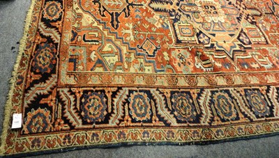 Lot 1508 - Heriz Carpet Persian Azerbaijan The madder field  of angular vines around an indigo medallion...