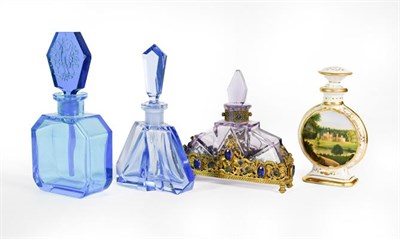 Lot 24 - Three Glass Scent-Bottles, two in blue, the third amethyst glass and with 'gem'-set gilt-metal...