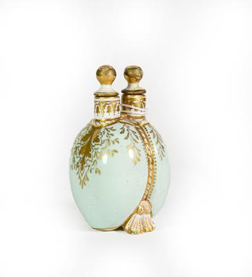 Lot 26 - A Ceramic Double Scent-Bottle, each side bombe and on shell feet, the sides gilt heightened on...