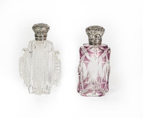 Lot 65 - Two Silver-Mounted Cut-Glass Scent-Bottles, One Circa 1840, oval clear glass, the hinged cover...