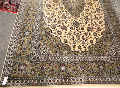 Lot 1514 - Pair of Kashan Carpets Central Persia Each with a cream field of palmettes and scrolling vines...