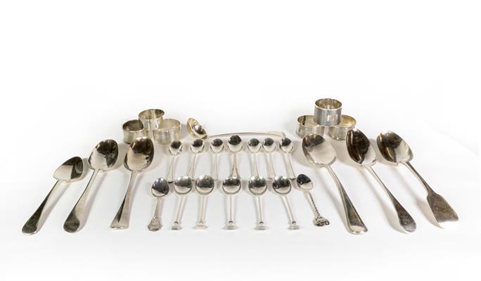 Lot 88 - A group of silver spoons and napkin rings, a serving spoon, George III, Newcastle, another...