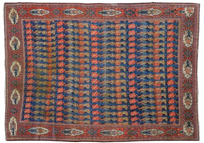 Lot 1519 - Senneh Carpet of Unusual Size Persian Kurdistan The mid-indigo abrashed field with rows of...