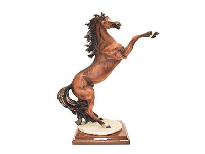 Lot 131 - A collection of Continental horse models including: a Katzhutte lady on horse riding side...