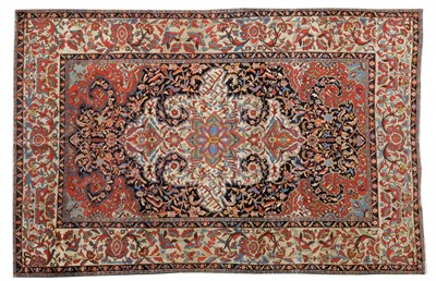 Lot 1520 - Fine Saroukh Carpet West Persia The deep indigo field of polychrome vines around an ivory medallion