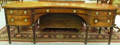 Lot 1524 - A George III Mahogany and Ebony Strung Inverted Breakfront Sideboard, late 18th century, the single