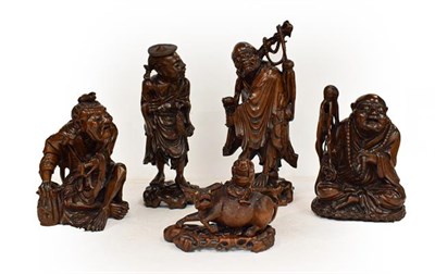 Lot 186 - Five late 19th/early 20th century Chinese hardwood carvings, a fisherman, a nomad, water...