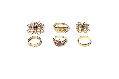 Lot 201 - Two 9 carat gold scroll brooches; an 18 carat gold band ring, out of shape; another band ring,...
