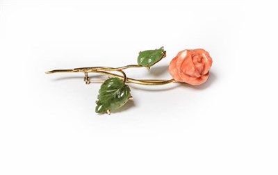 Lot 203 - A coral and nephrite floral spray brooch, stamped '750', length 7.5cm