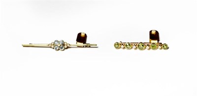 Lot 212 - An aquamarine and split pearl bar brooch, length 5.8cm and a peridot and split pearl bar...