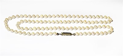 Lot 214 - A cultured pearl necklace knotted to a sapphire clasp stamped '750', length 81.5cm