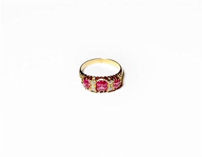 Lot 222 - A synthetic ruby and diamond ring, three graduated oval cut synthetic rubies alternate with...
