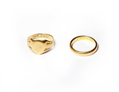 Lot 233 - A 22 carat gold band ring, finger size P1/2; and an 18 carat gold signet ring, finger size R