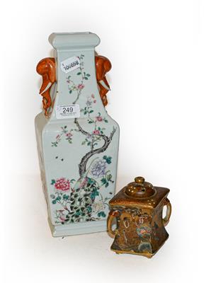 Lot 249 - A Chinese Republic period square baluster vase with twin elephant mask handles and decorated in the