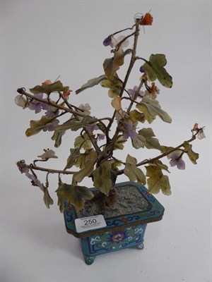 Lot 250 - A Chinese cloisonne planter with hardstone tree