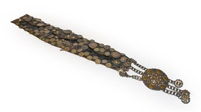 Lot 251 - A South American leather belt, decorated with various World coinage from Bolivia, Uruguay, Jamaica