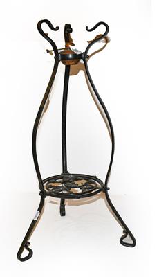 Lot 253 - A 19th century painted wrought iron kettle stand