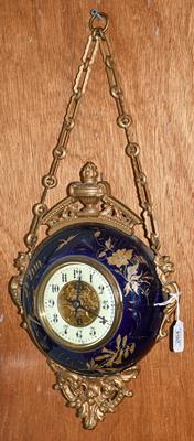Lot 264 - A gilt metal and enamel wall timepiece
