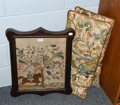 Lot 277 - Two decorative embroidered rectangular cushions and a woolwork embroidery of a huntsman in a shaped