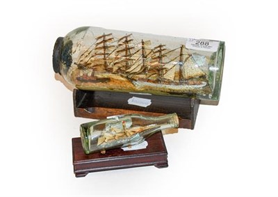 Lot 288 - Two ships in bottles, with wooden stands, possibly a Redcar connection (2)