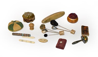 Lot 291 - A collection of sewing accessories including pin cushions, needle case, hat pins etc