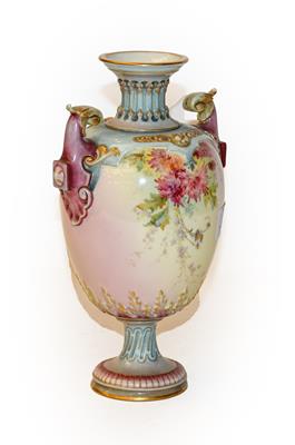 Lot 305 - A Royal Worcester floral painted twin-handled vase, shape no - 1618, bearing puce marks, 23cm